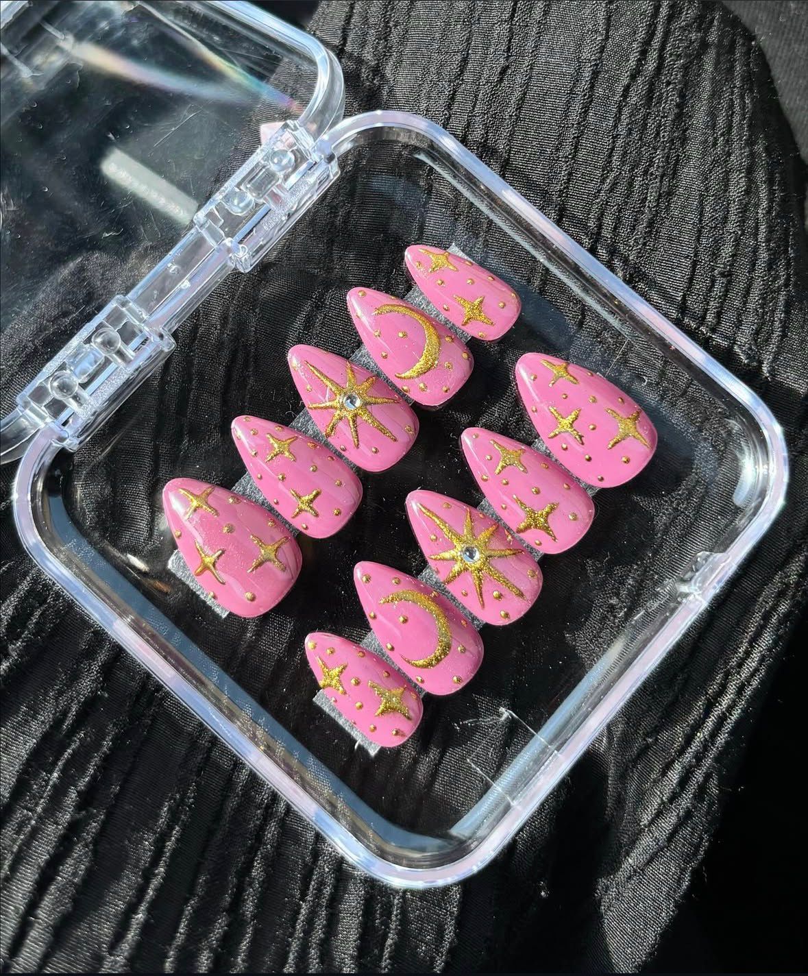 Pink celestial moon and stars set